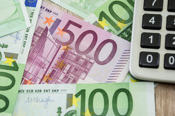 500 euro close up, 100 euro and calculator. Close-up.