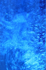 Abstract vertical background of boiling water, swirling water bubbles