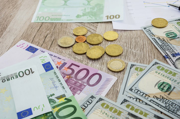Euro, dollars, coins on the table, close-up.