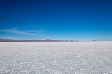 Landscape of incredibly white salt flat Salar de Uyuni, amid the Andes in southwest Bolivia, South...