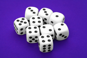 White dices against a blue background