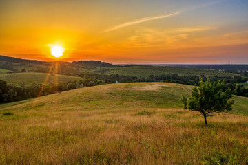 Hilly landscape on sunset time