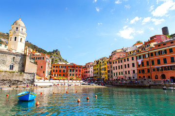 Naklejka premium Liguria, Italy coastline of Riviera with colorful houses on sunny warm day. Monterosso al Mare, Vernazza, Corniglia, Manarola and Riomaggiore, Cinque Terre National Park UNESCO World Heritage