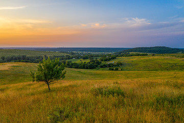 Hilly landscape on sunset time