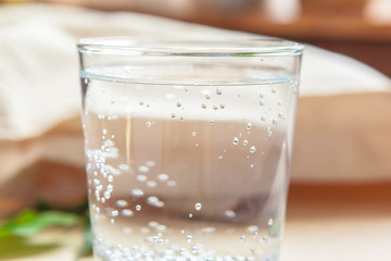 Glass of pure water on kitchen table