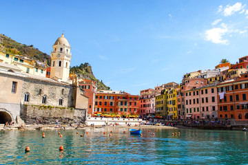 Fototapeta na wymiar Liguria, Italy coastline of Riviera with colorful houses on sunny warm day. Monterosso al Mare, Vernazza, Corniglia, Manarola and Riomaggiore, Cinque Terre National Park UNESCO World Heritage