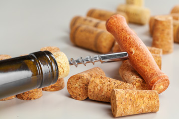 Opening wine bottle with a corkscrew close up