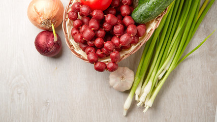 Basket with sausage and vegetables