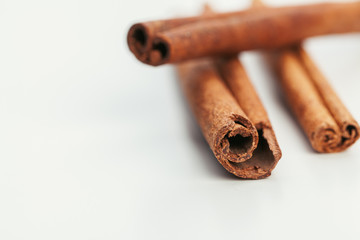 Cinnamon sticks isolated on white background close up