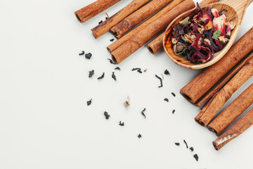 Dried tea heaped teaspoonful on white background, closeup