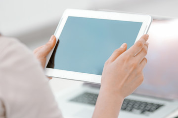 close up. businesswoman pushing using digital tablet.