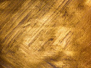 Golden grunge texture. Vintage abstract golden background for your design. Luxury golden background. Shiny golden texture.