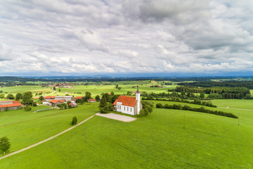 Fototapeta na wymiar Germany, Bavaria, Allgäu, aerial view of church St. Alban