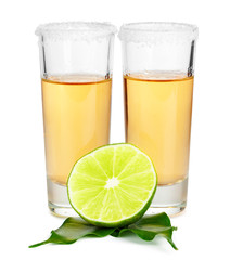 Shot of tequila with a slice of lime no white background