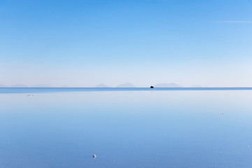 Fototapeta na wymiar Uyuni Salt Flats in Bolivia, the incredible mirror-like lake in South America