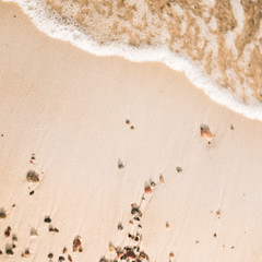 Sea Beach and Soft wave of blue ocean. Summer day and sandy beach background.