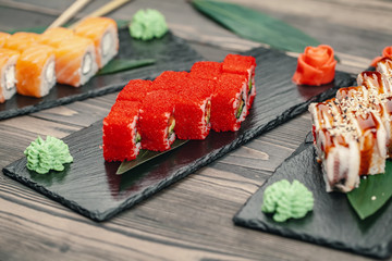 Sushi served on a slate plate in a restaurant