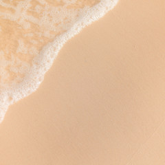 Sea Beach and Soft wave of blue ocean. Summer day and sandy beach background.