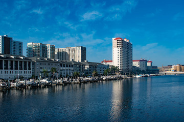  Tampa Bay, Florida. April 28, 2019 . Luxury boats on Harbour Island dockside on sunrise background...