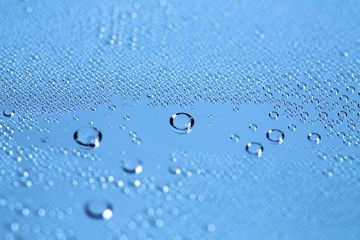 Water Drops. Bubbles close-up. The texture of gel cream. Oxygen bubbles in clear blue water, close-up. Mineral water. Water enriched with oxygen.