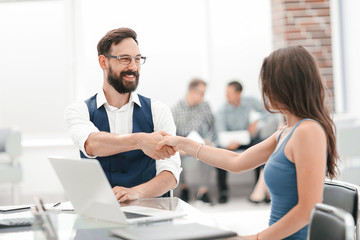 handshake of a Manager and a customer at the Desk