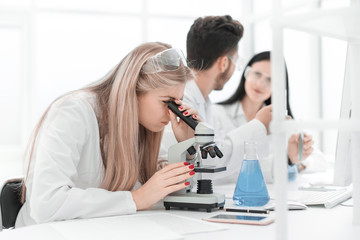 close up. a group of scientists conduct research in a modern laboratory