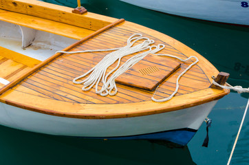 Small wooden boat anchored in the harbor