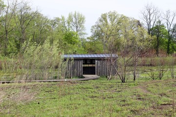 A old wood building shack in the countryside .