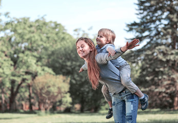 happy mom and her son on a walk in the summer Park