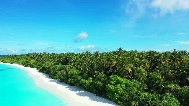paradise beach with white sand on Thailand. Beautiful blue sea and palm trees aerial drone dolly in establishing shot
