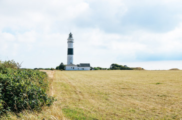 Fototapeta na wymiar White and blue lighthouse on the island Sylt, Germany