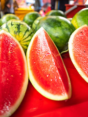 Cut juicy watermelons on market stall in Malaysia