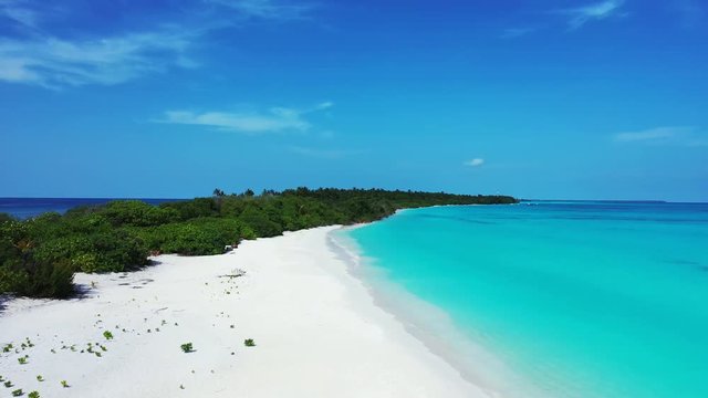 aerial drone pedestal down dolly in shot of tropical beach, scenic turquoise water and white sand, Tomia Island, Wakatobi marine national park, Indonesia, paradise travel location