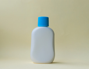 Plastic bottle on the yellow background.
