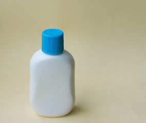 Plastic bottle on the yellow background.