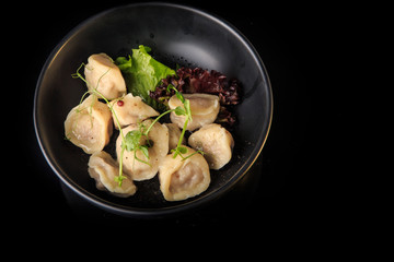 top view on steamed meat dumplings with salad in bowl