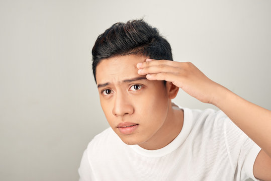 Young Man Struggling With Acne On His Face Caring For His Skin Pushes Acne