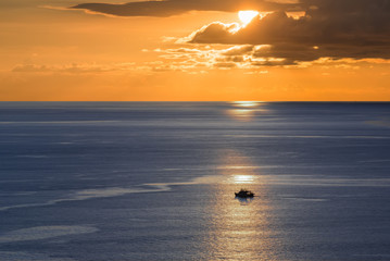 Magic tropical sunset with palm trees and sea view. Fantastic sky and clouds