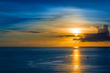 Magic tropical sunset with palm trees and sea view. Fantastic sky and clouds