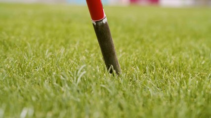 spearhead stabs in ground / olympic / javelin thrower - Powered by Adobe