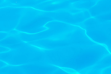 Clear transparent light blue water in the pool. Texture, water background in the pool_