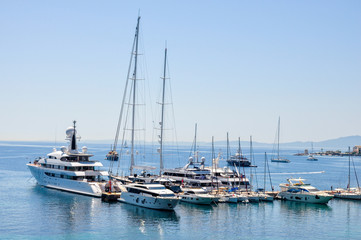 Fototapeta na wymiar A lot of yachts at the shore in Corfu Town