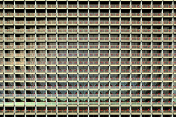 3D rendering of uniformed looking apartments in a huge and overcrowded apartment building