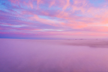 Fototapeta premium Beautiful sunset cloudy sky from aerial view.