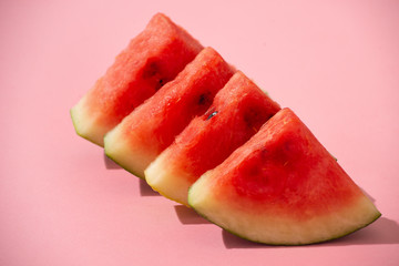 Sliced watermelon on the pink background