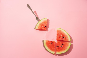 Sliced watermelon on the pink background