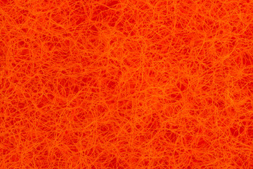 Bright orange surface of small intertwined hairs. Nanofibers and super macro zoom. Abstract orange...