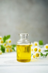 Obraz na płótnie Canvas Camomile aromatherapy oil for massage