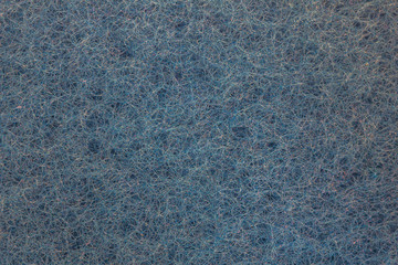 Blue abstract background consisting of a million small intertwining hairs. Nanofibres and microstructure of the enlarged surface of the material. The pattern created in a natural way.