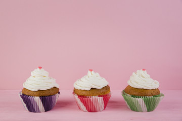 Three cupcakes for birthday with copyspace